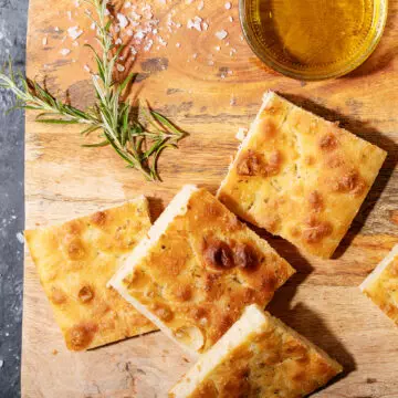 Baked focaccia bread served with olives